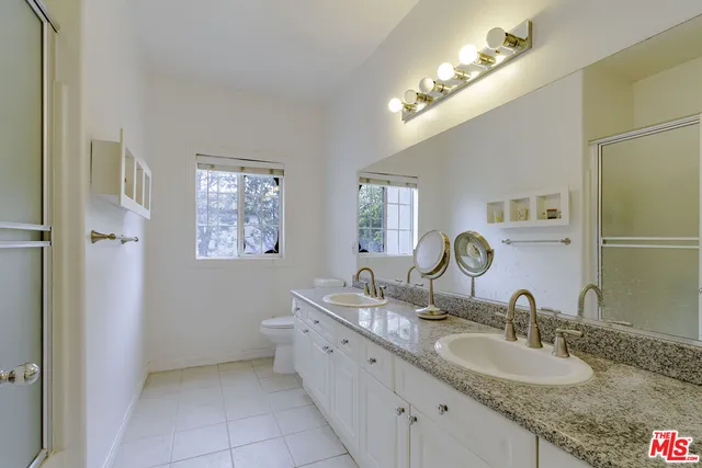 a bedroom with a bed and a chair