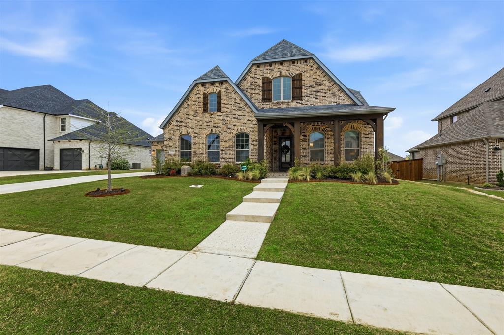11116 Emory Oak Ridge Flower Mound, TX 76226 - Photo 1 of 40 a front view of a house with a yard