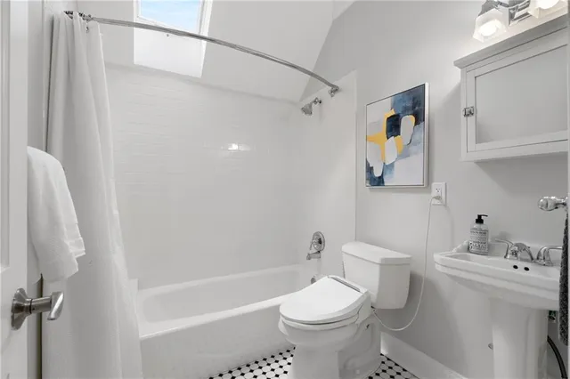 a view of a balcony with chairs and a potted plant