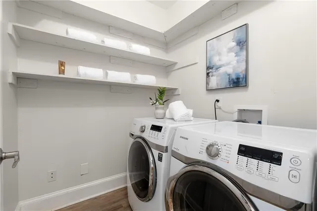 a view of a garden with large trees