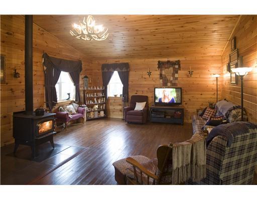 236 County Road Kenduskeag, ME 04450 - Photo 3 of 23 Living Room. Natural pine interior