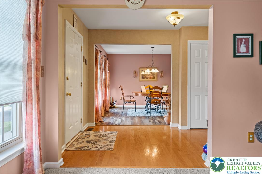 2652 Thistle Road Lower Macungie Township, PA 18062 - Photo 12 of 66 a view of a bedroom kitchen and hall with wooden floor