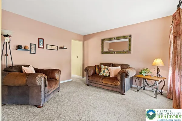 a kitchen with stainless steel appliances kitchen island granite countertop a refrigerator a stove top oven a sink and dishwasher