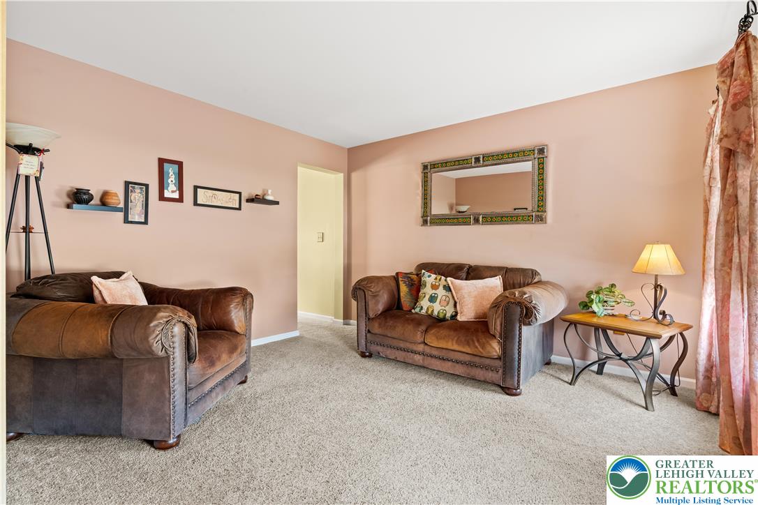 2652 Thistle Road Lower Macungie Township, PA 18062 - Photo 17 of 66 a living room with furniture and a couch