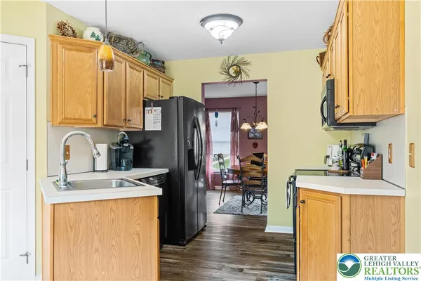 a kitchen with stainless steel appliances granite countertop a stove and a microwave