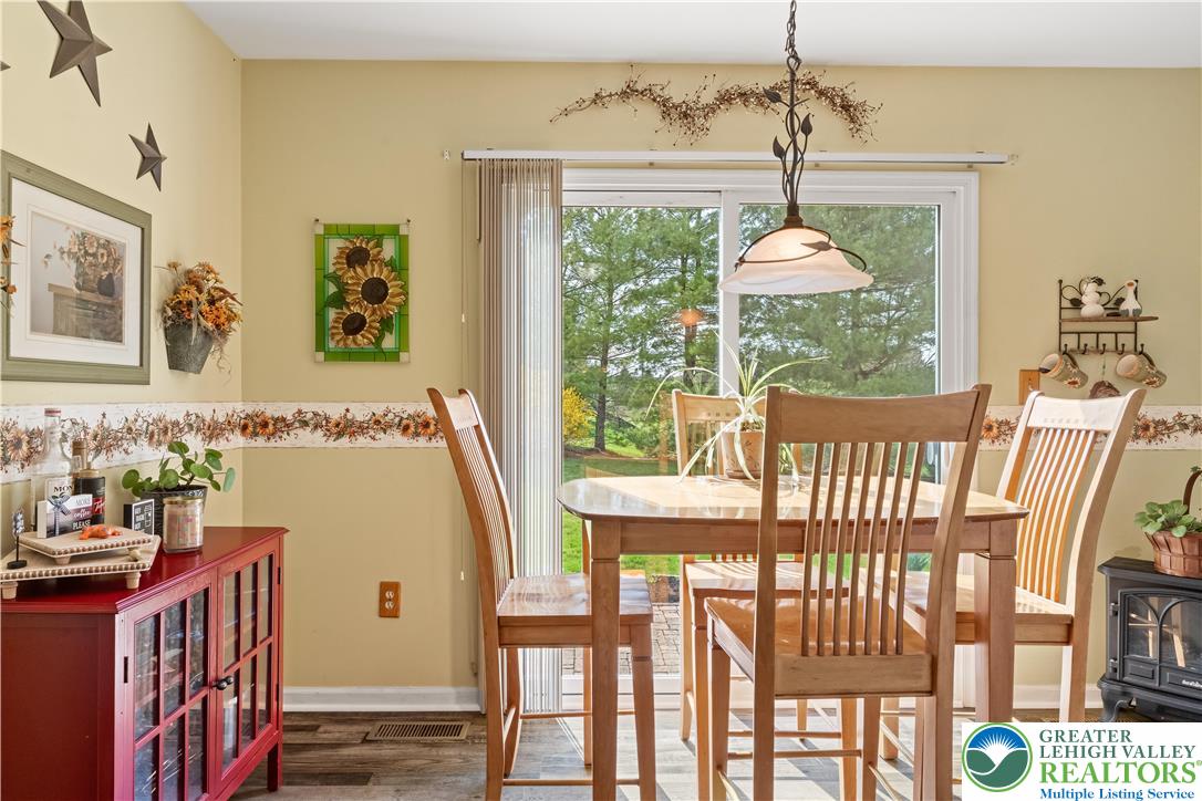 2652 Thistle Road Lower Macungie Township, PA 18062 - Photo 24 of 66 a view of a dining room with furniture window and outside view