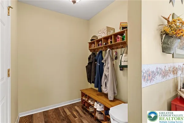 a view of a hallway with wooden shelves