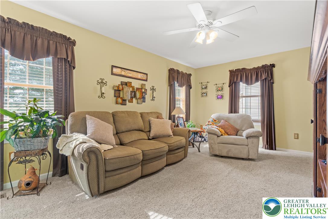 2652 Thistle Road Lower Macungie Township, PA 18062 - Photo 27 of 66 a living room with furniture and a large window
