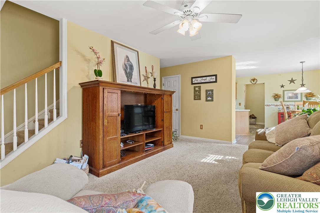 2652 Thistle Road Lower Macungie Township, PA 18062 - Photo 28 of 66 a living room with furniture and a flat screen tv