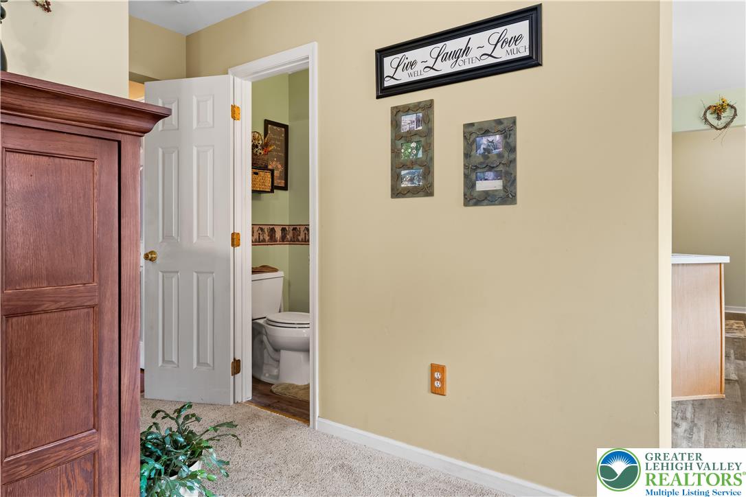 2652 Thistle Road Lower Macungie Township, PA 18062 - Photo 29 of 66 a view of a hallway with wooden shelves