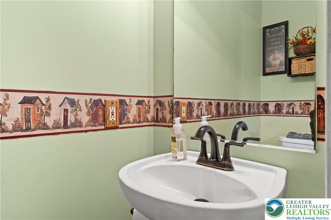 2652 Thistle Road Lower Macungie Township, PA 18062 - Photo 30 of 66 a bathroom with a sink and a mirror