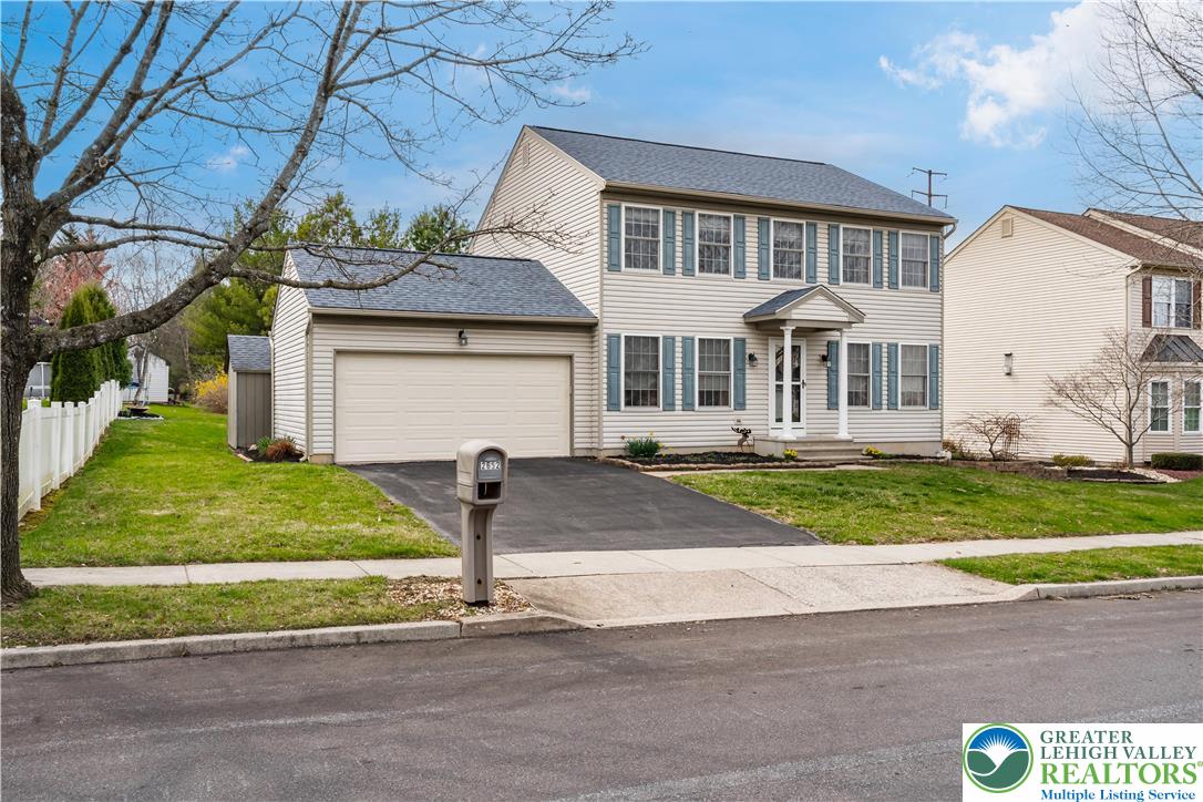 2652 Thistle Road Lower Macungie Township, PA 18062 - Photo 3 of 66 a front view of a house with a yard
