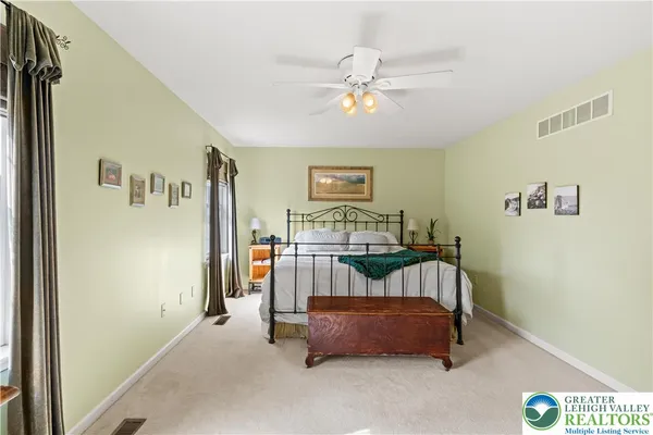 a bedroom with a bed and a table in it