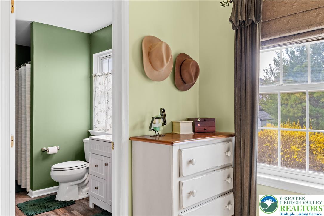2652 Thistle Road Lower Macungie Township, PA 18062 - Photo 35 of 66 a bathroom with a toilet a sink and a window