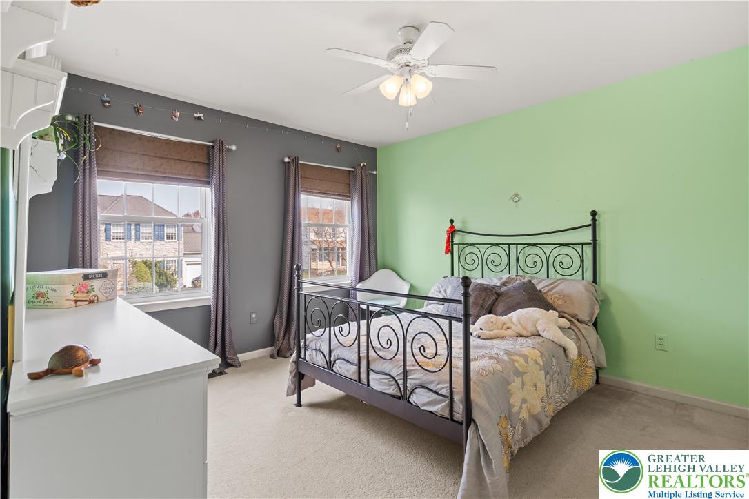 2652 Thistle Road Lower Macungie Township, PA 18062 - Photo 38 of 66 a bedroom with a bed and a chandelier