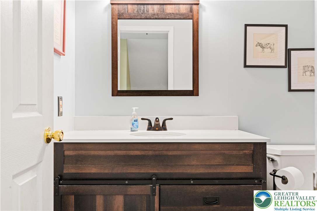 2652 Thistle Road Lower Macungie Township, PA 18062 - Photo 42 of 66 a bathroom with a sink and a mirror