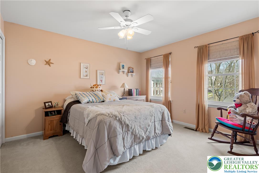 2652 Thistle Road Lower Macungie Township, PA 18062 - Photo 43 of 66 a bed room with a bed and a chandelier