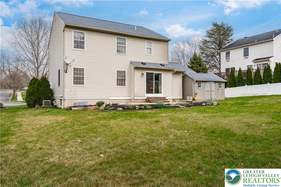 2652 Thistle Road Lower Macungie Township, PA 18062 - Photo 54 of 66 a view of a house with a yard
