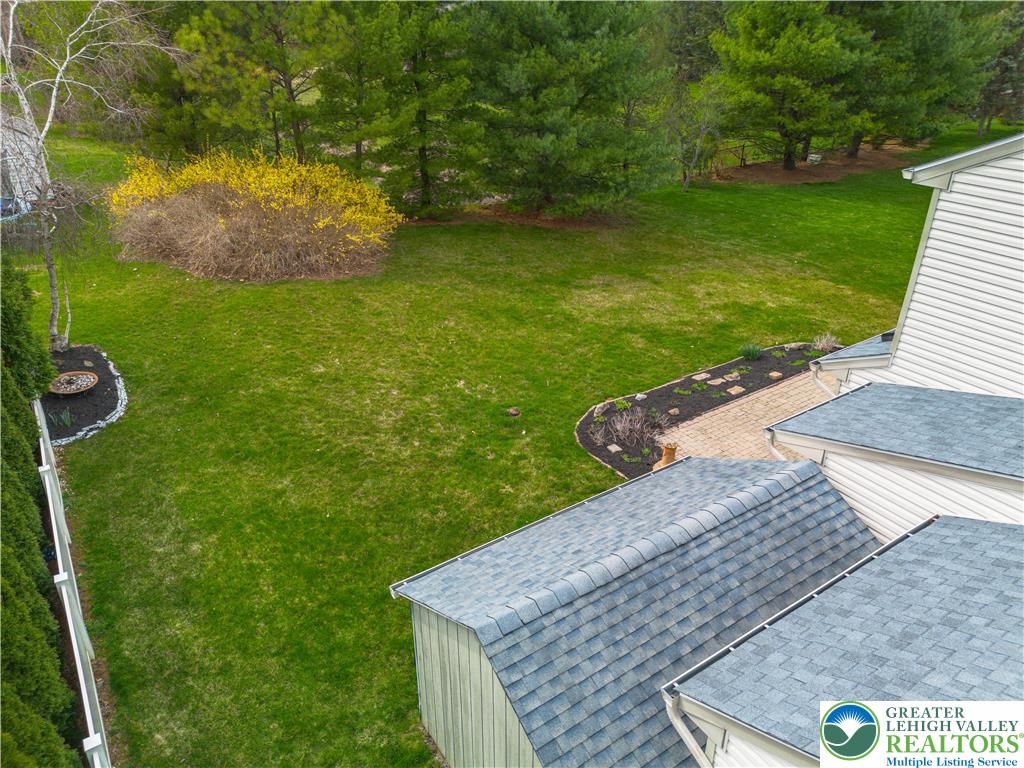 2652 Thistle Road Lower Macungie Township, PA 18062 - Photo 60 of 66 a view of a backyard with a garden