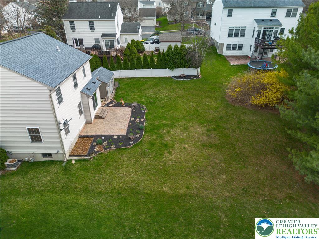 2652 Thistle Road Lower Macungie Township, PA 18062 - Photo 61 of 66 a aerial view of a house with a yard table and chairs
