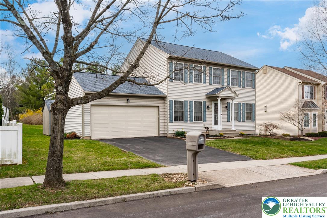 2652 Thistle Road Lower Macungie Township, PA 18062 - Photo 7 of 66 a front view of a house with a yard