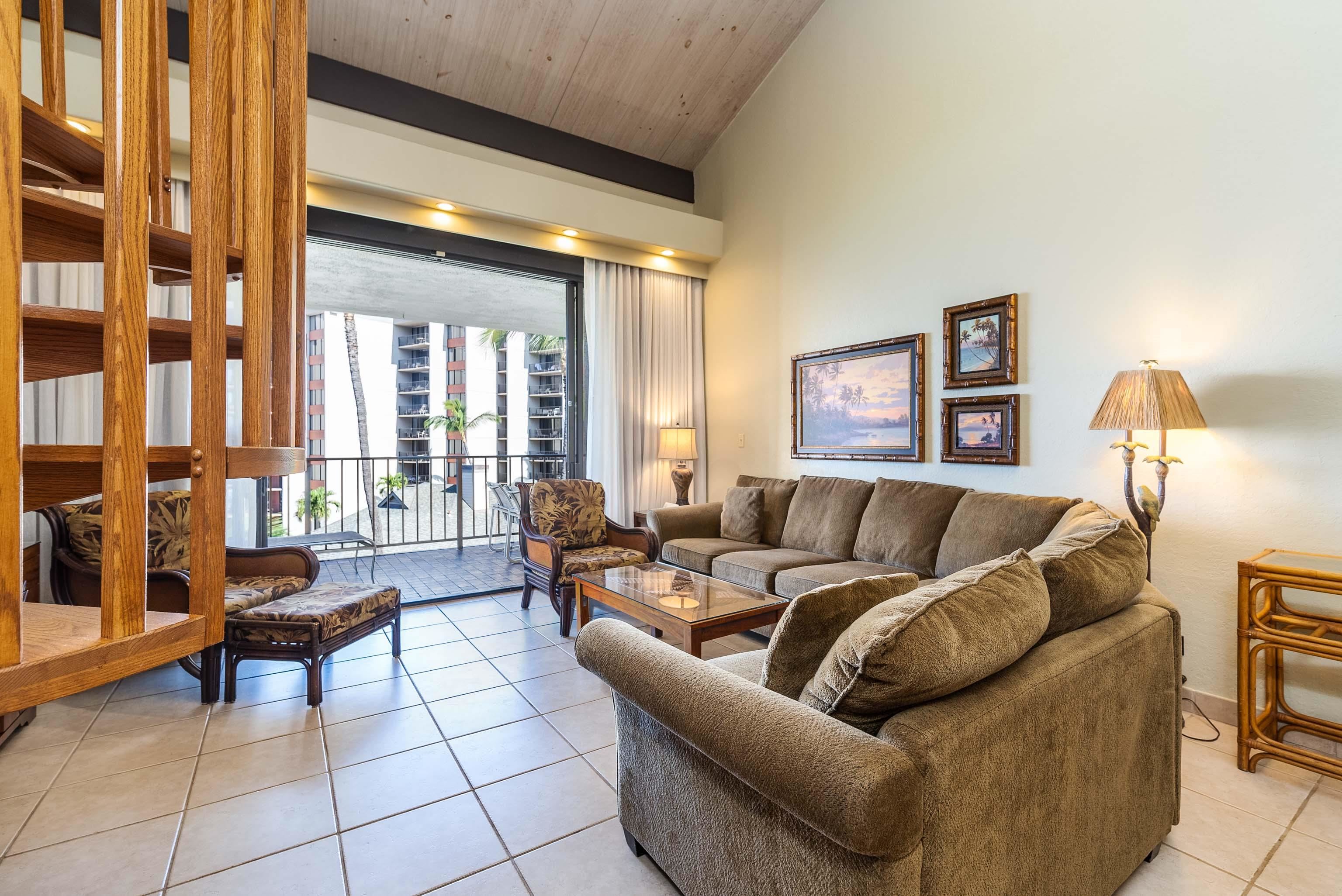3445 Lower Honoapiilani Road, Unit 456 Lahaina, HI 96761 - Photo 12 of 32 a living room with furniture and a large window