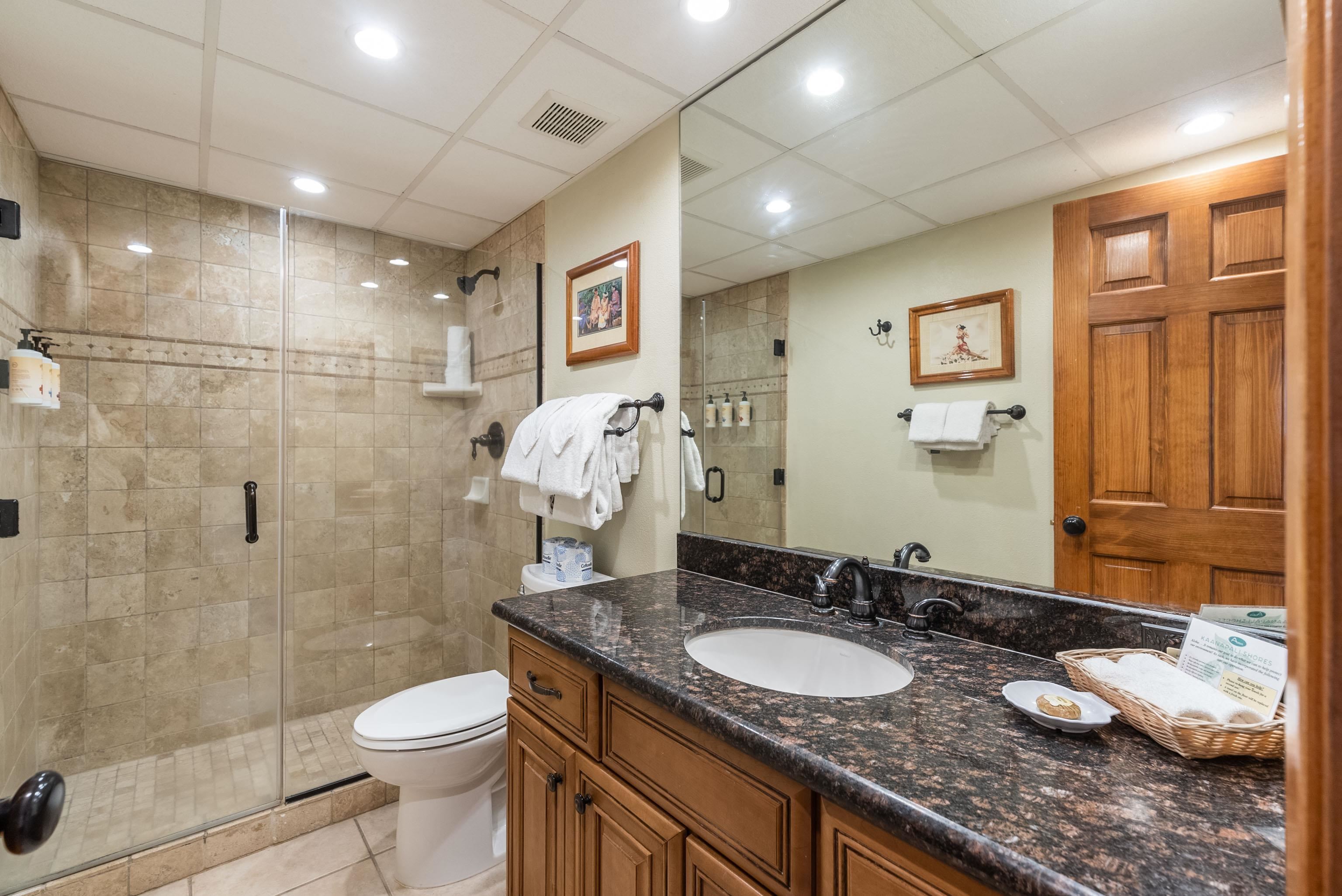 3445 Lower Honoapiilani Road, Unit 456 Lahaina, HI 96761 - Photo 14 of 32 a bathroom with a granite countertop sink a toilet and shower