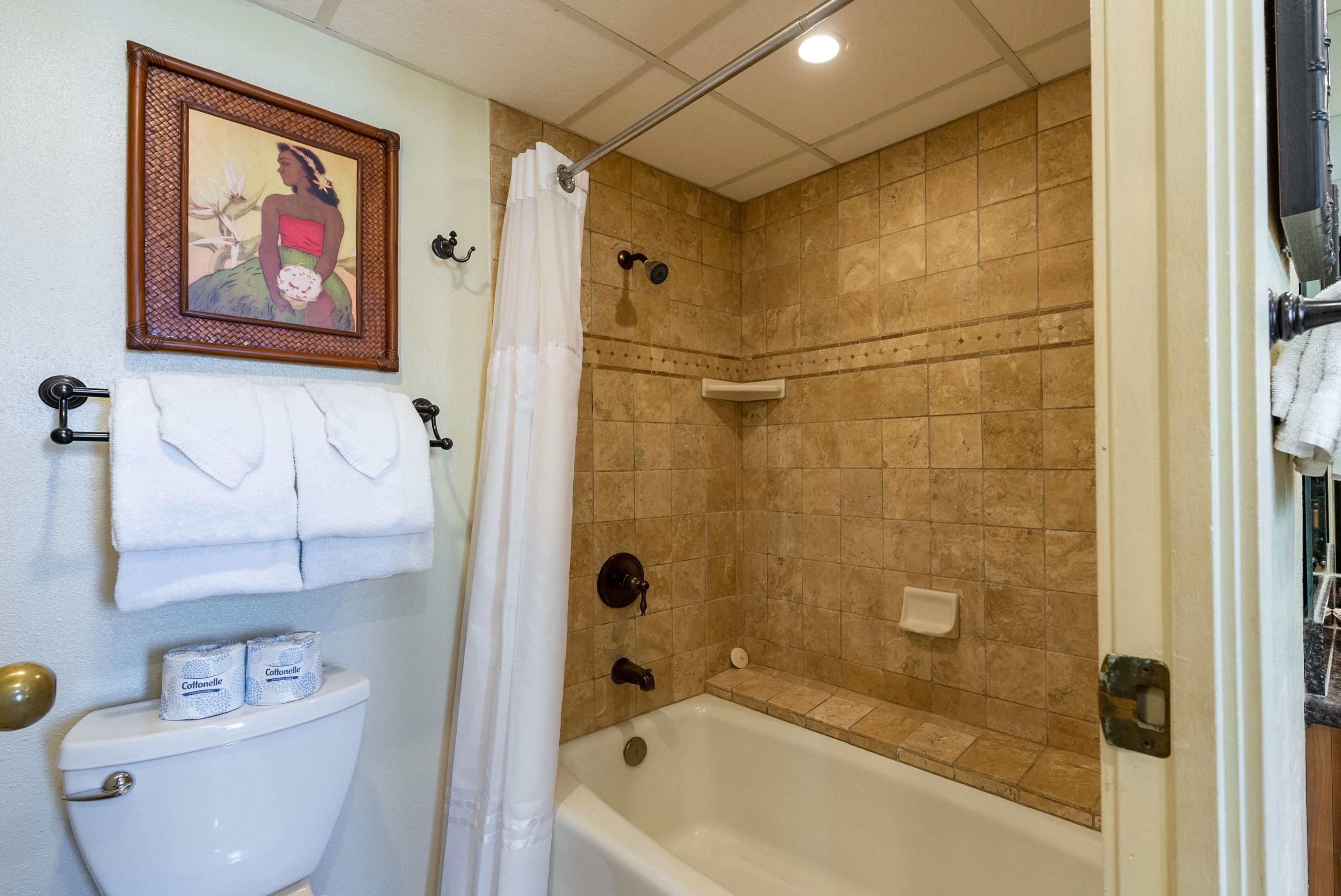 3445 Lower Honoapiilani Road, Unit 456 Lahaina, HI 96761 - Photo 15 of 32 a bathroom with a bathtub and a shower