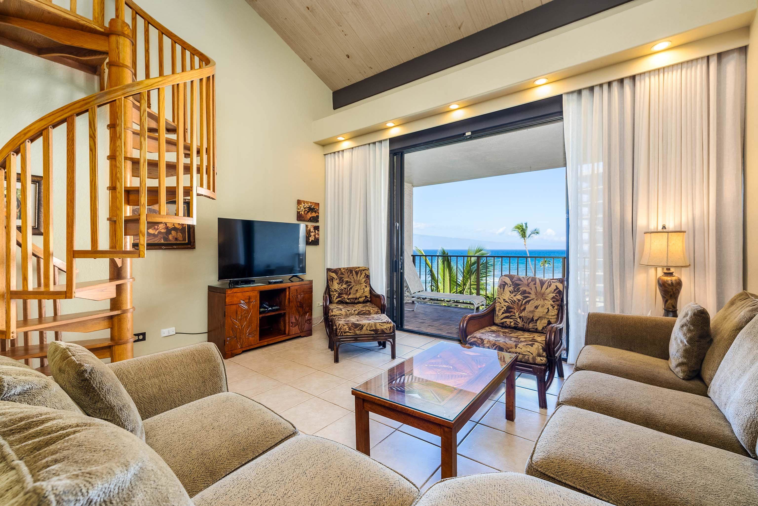 3445 Lower Honoapiilani Road, Unit 456 Lahaina, HI 96761 - Photo 5 of 32 a living room with furniture and a flat screen tv