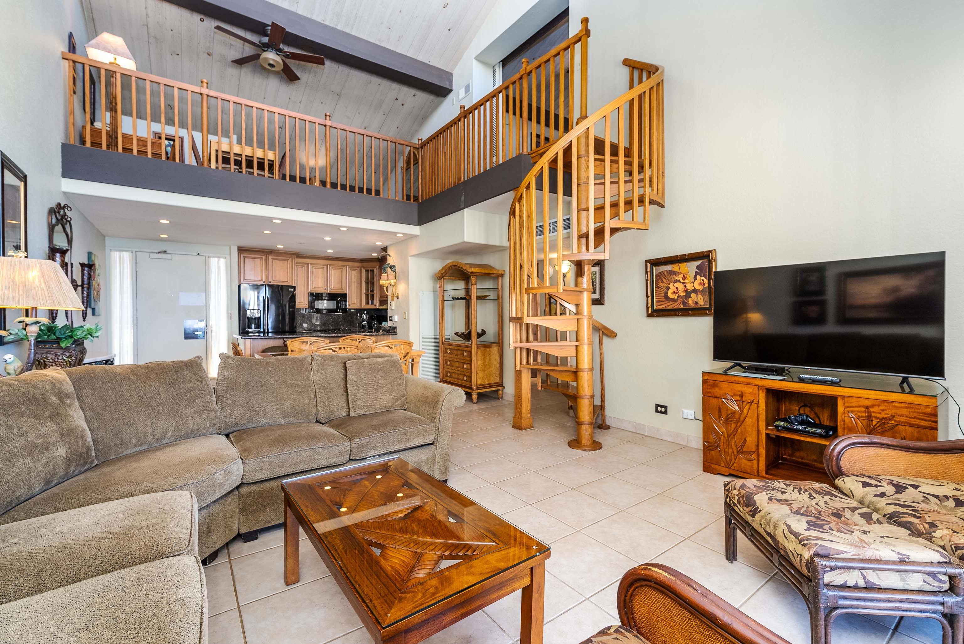 3445 Lower Honoapiilani Road, Unit 456 Lahaina, HI 96761 - Photo 6 of 32 a living room with furniture and a flat screen tv