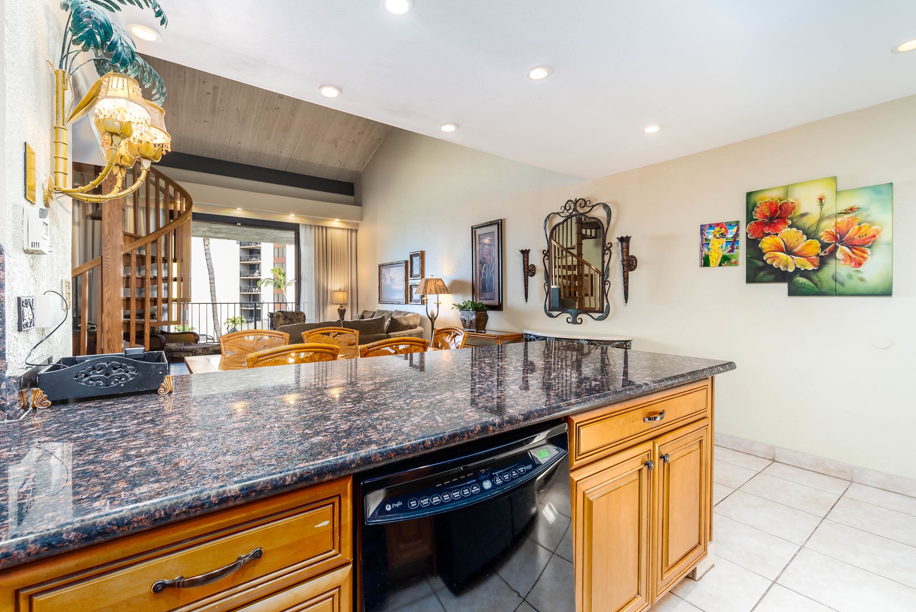 3445 Lower Honoapiilani Road, Unit 456 Lahaina, HI 96761 - Photo 9 of 32 a kitchen with kitchen island granite countertop a stove and a sink