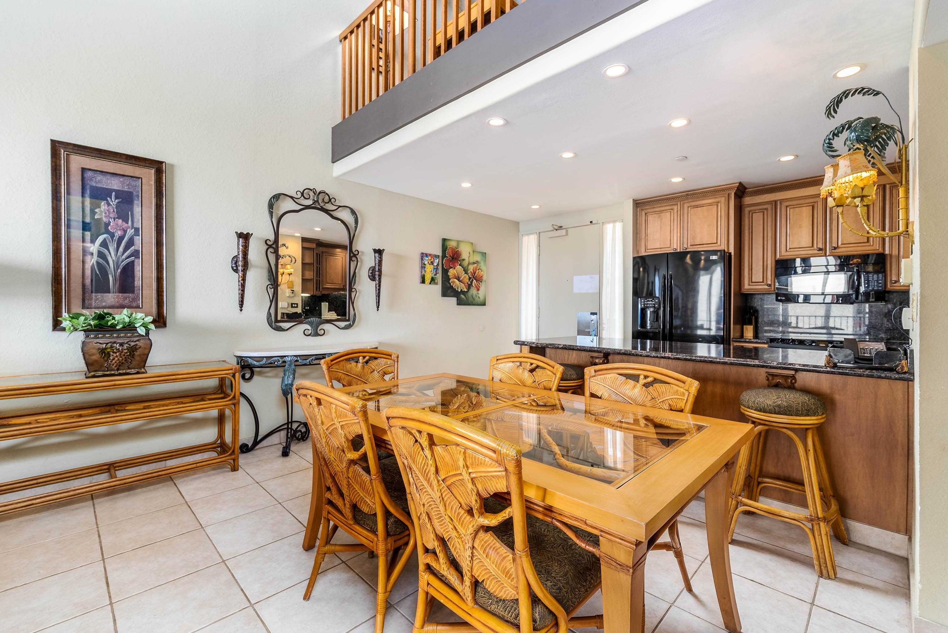 3445 Lower Honoapiilani Road, Unit 456 Lahaina, HI 96761 - Photo 10 of 32 a dining hall with stainless steel appliances a dining table and chairs