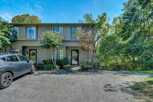 a view of a car park in front of house