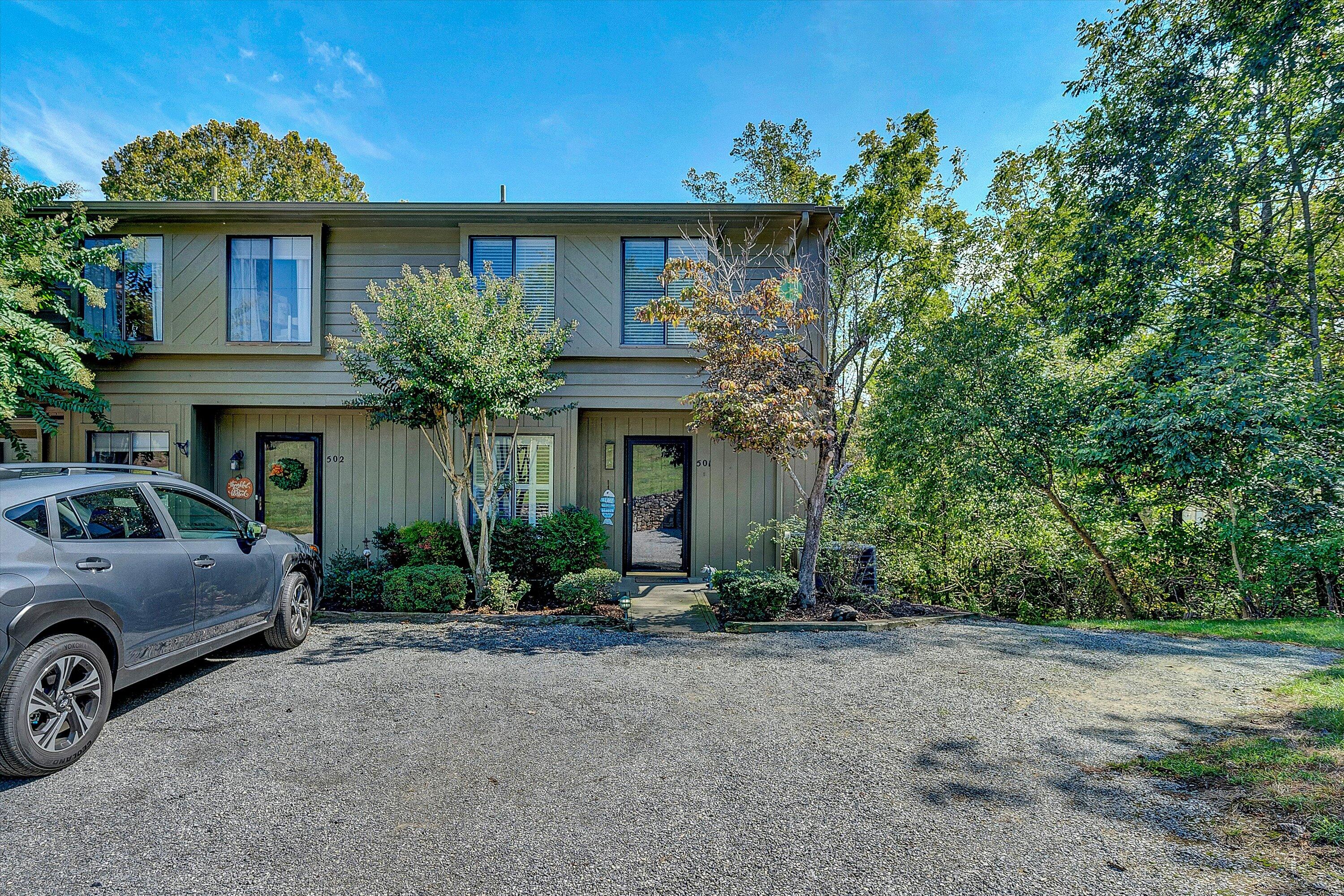 a view of a car park in front of house