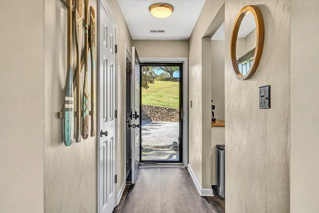 a view of a livingroom with furniture and a window