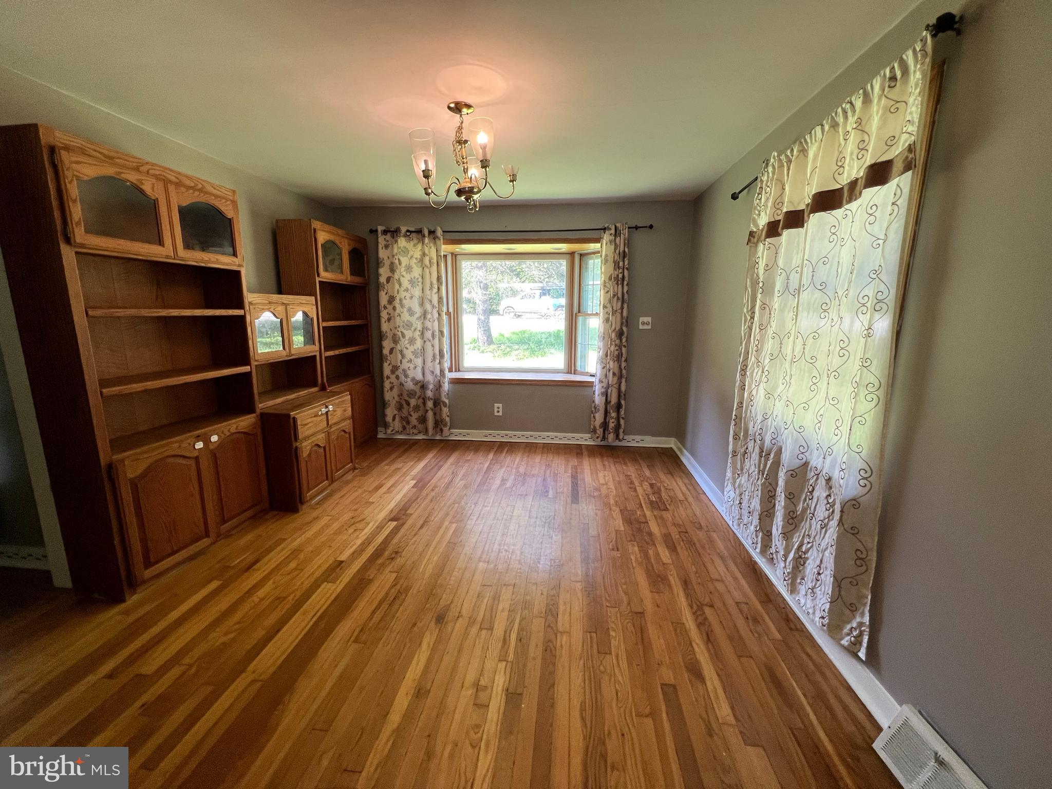 132 Conestoga Road Devon, PA 19333 - Photo 11 of 14 a view of empty room with wooden floor and fan