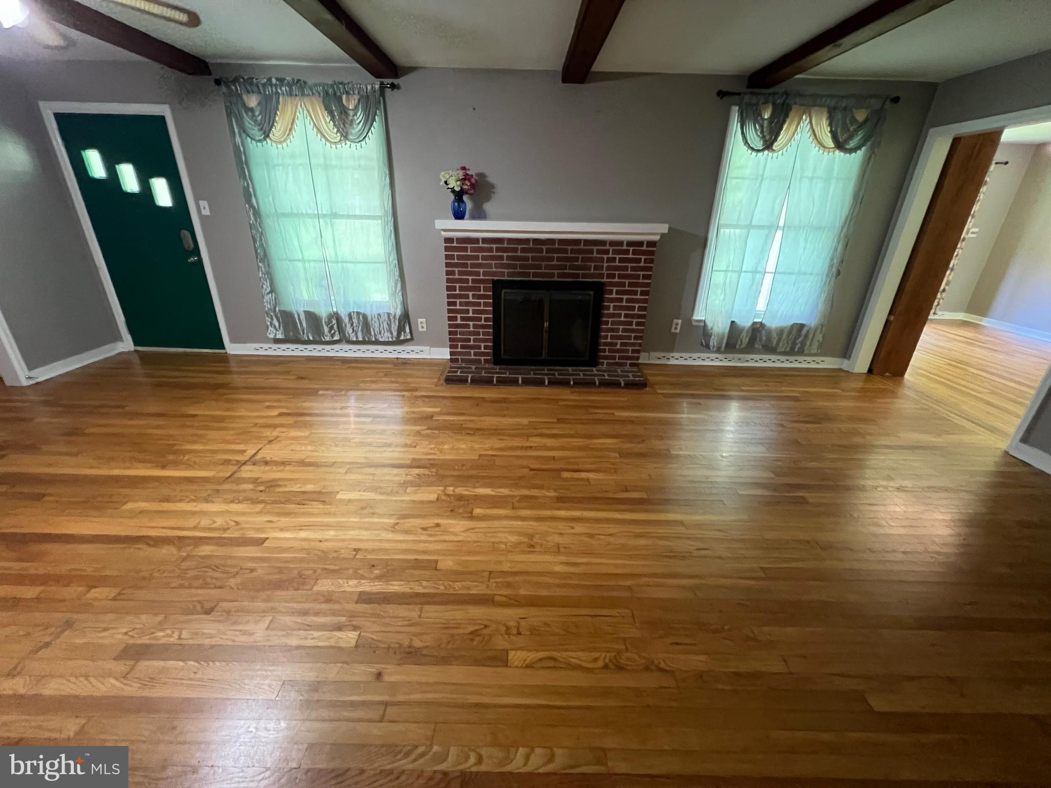 132 Conestoga Road Devon, PA 19333 - Photo 2 of 14 a view of empty room with window and fireplace