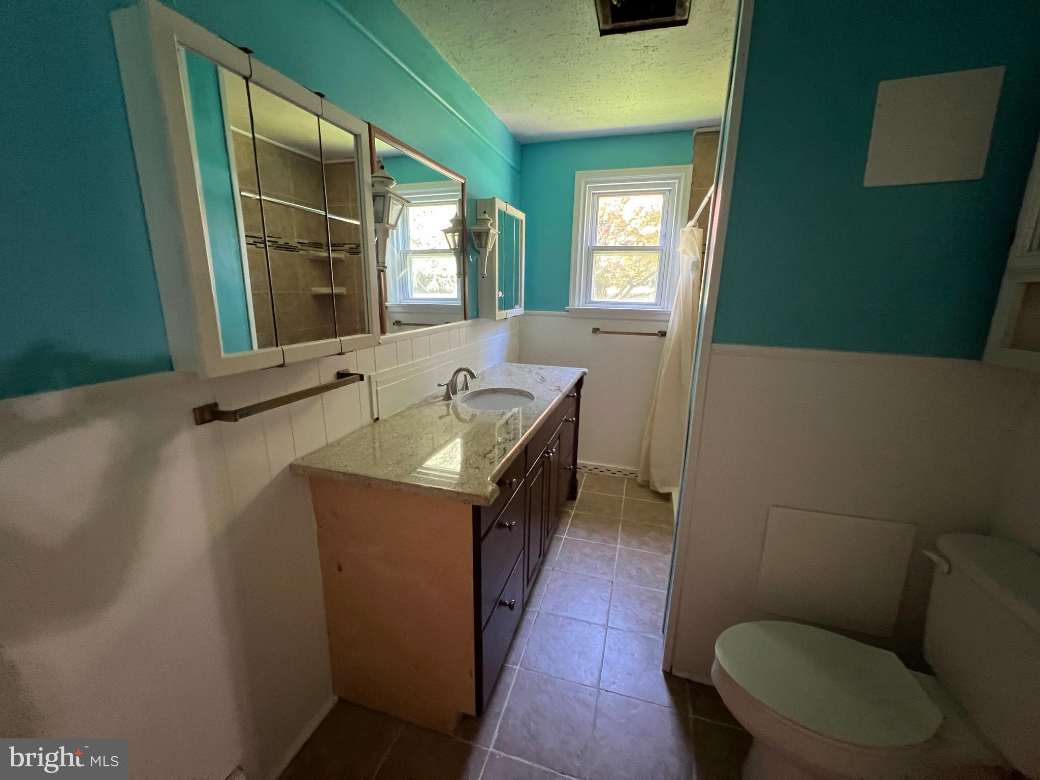 132 Conestoga Road Devon, PA 19333 - Photo 6 of 14 a bathroom with a toilet sink and mirror