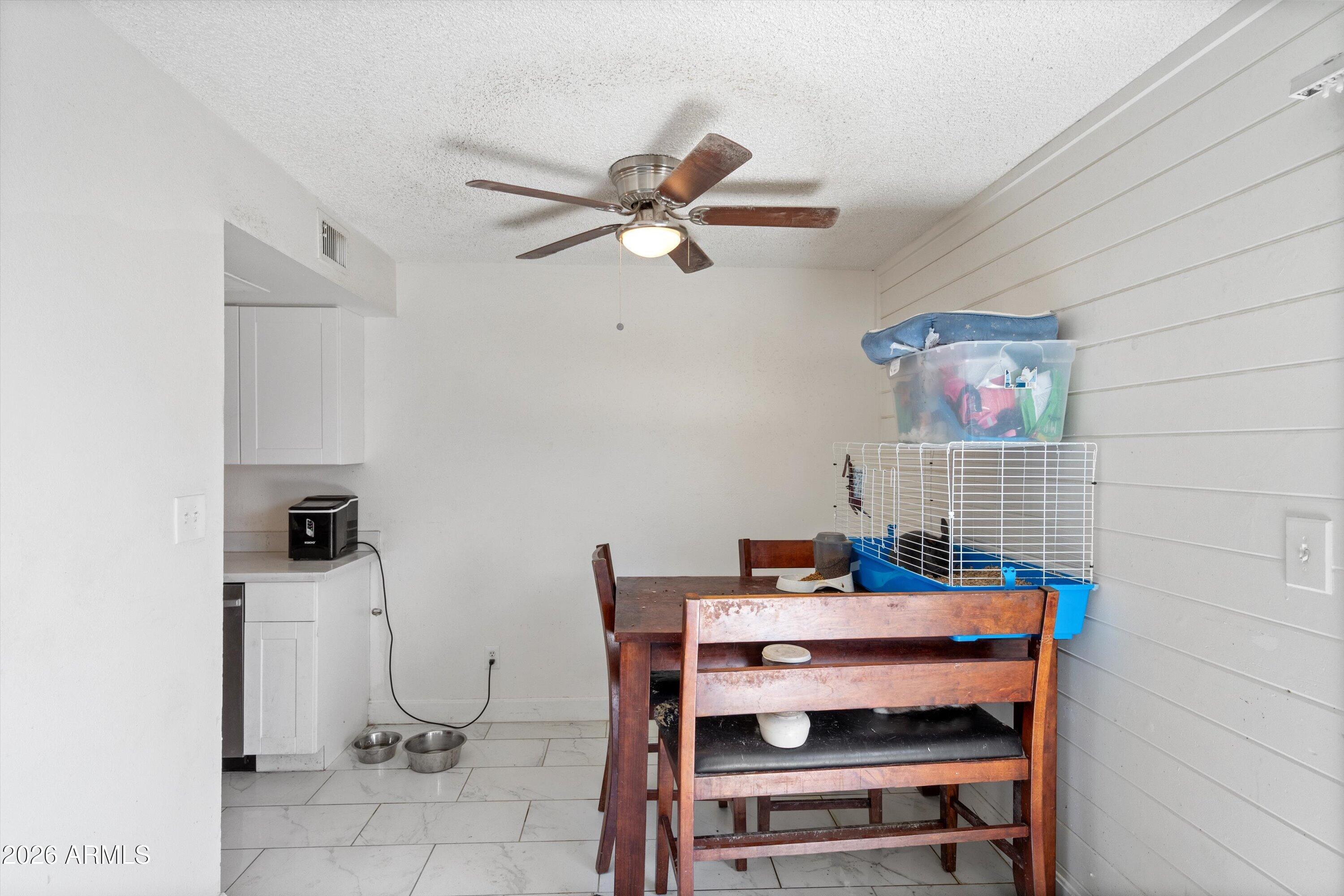 600 South Dobson Road, Unit 88 Mesa, AZ 85202 - Photo 11 of 18 a dining room with furniture and a chandelier fan