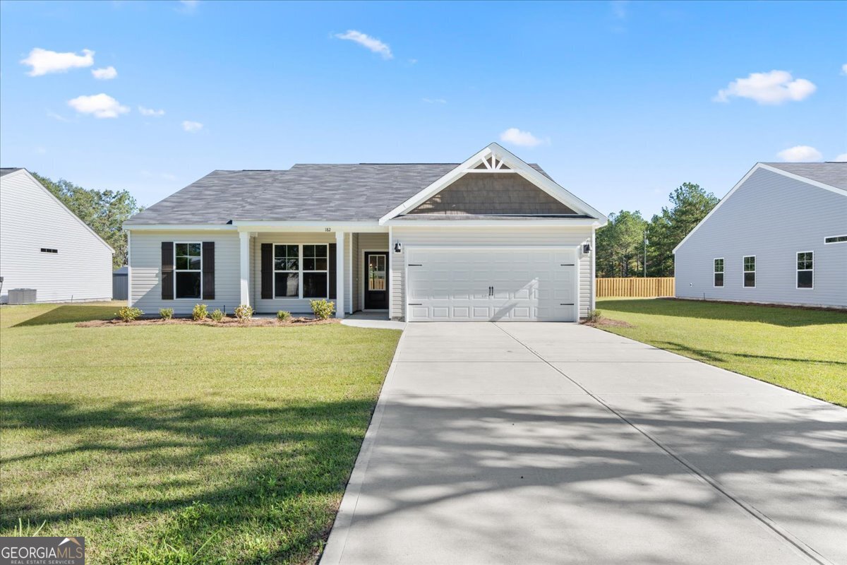 182 Rogers Road Pembroke, GA 31321 - Photo 1 of 1 a house view with swimming pool in front of it