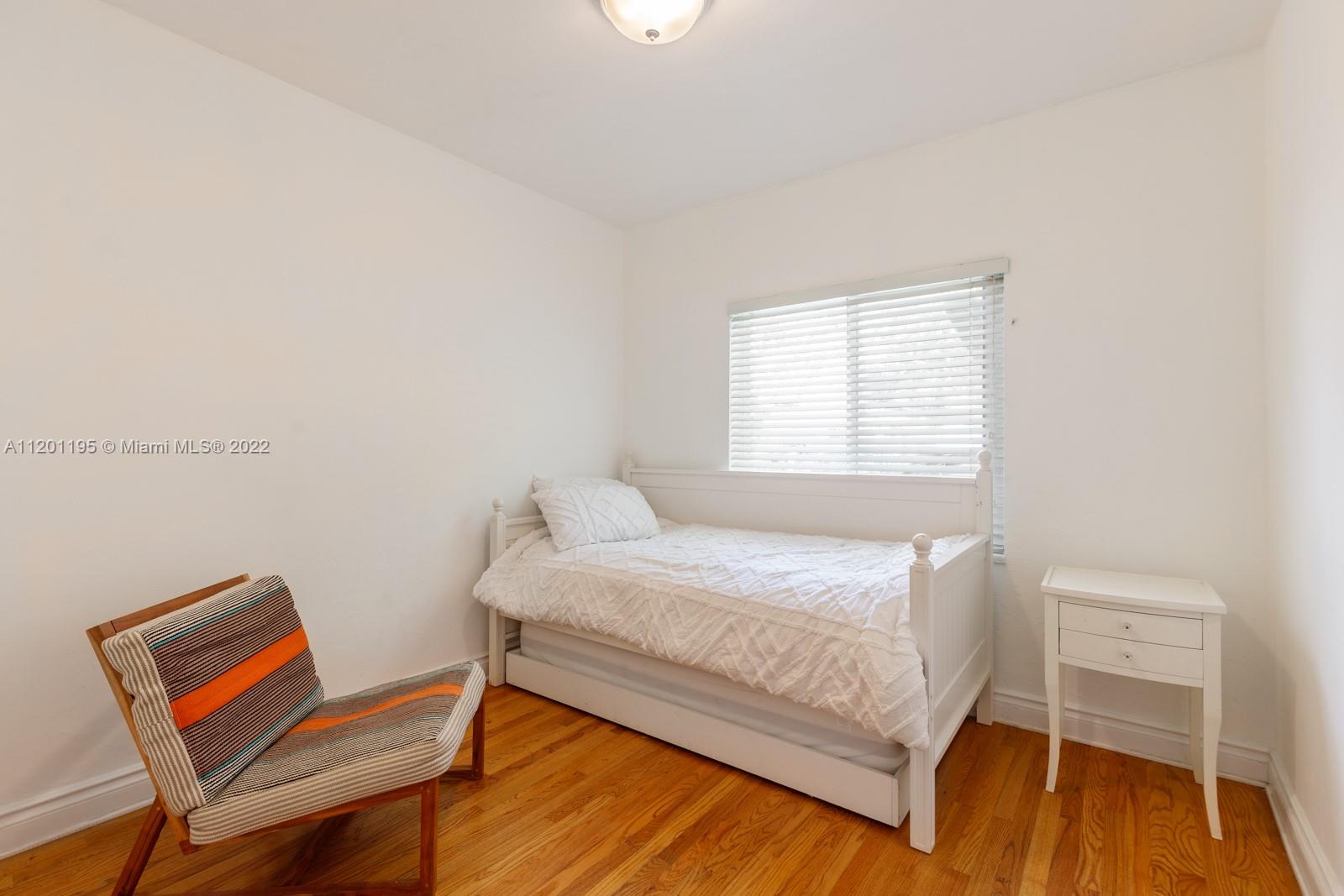 7236 School House Road Miami, FL 33143 - Photo 17 of 25 a bedroom with a bed chair and a window