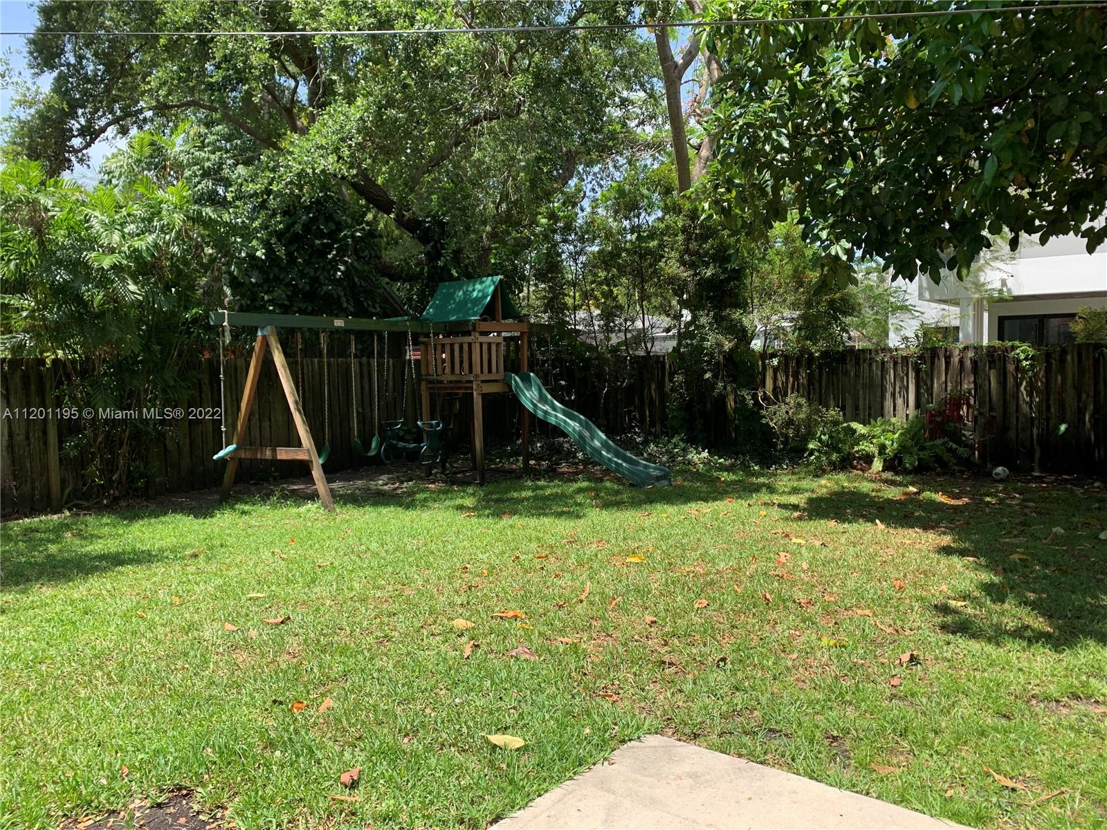 7236 School House Road Miami, FL 33143 - Photo 18 of 25 a view of a backyard with a slide