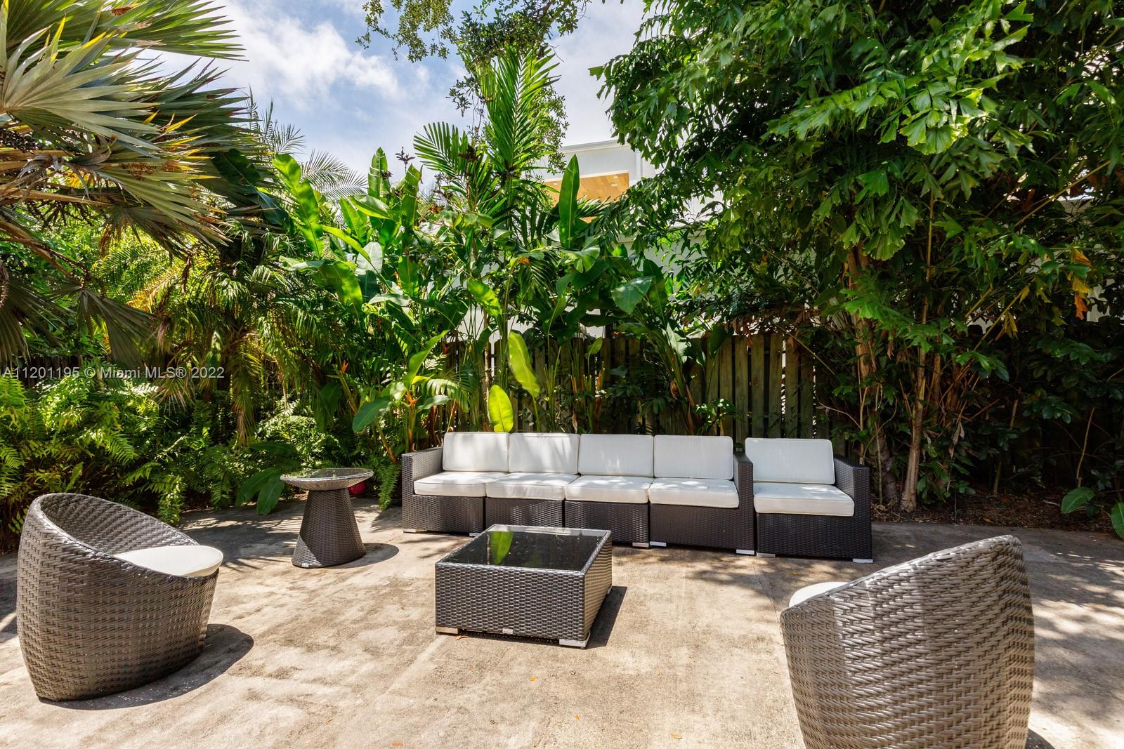 7236 School House Road Miami, FL 33143 - Photo 19 of 25 a view of backyard with seating space