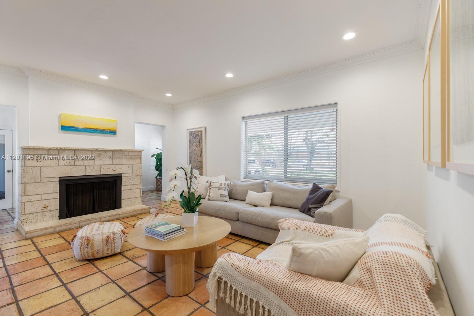7236 School House Road Miami, FL 33143 - Photo 4 of 25 a living room with furniture and a fireplace