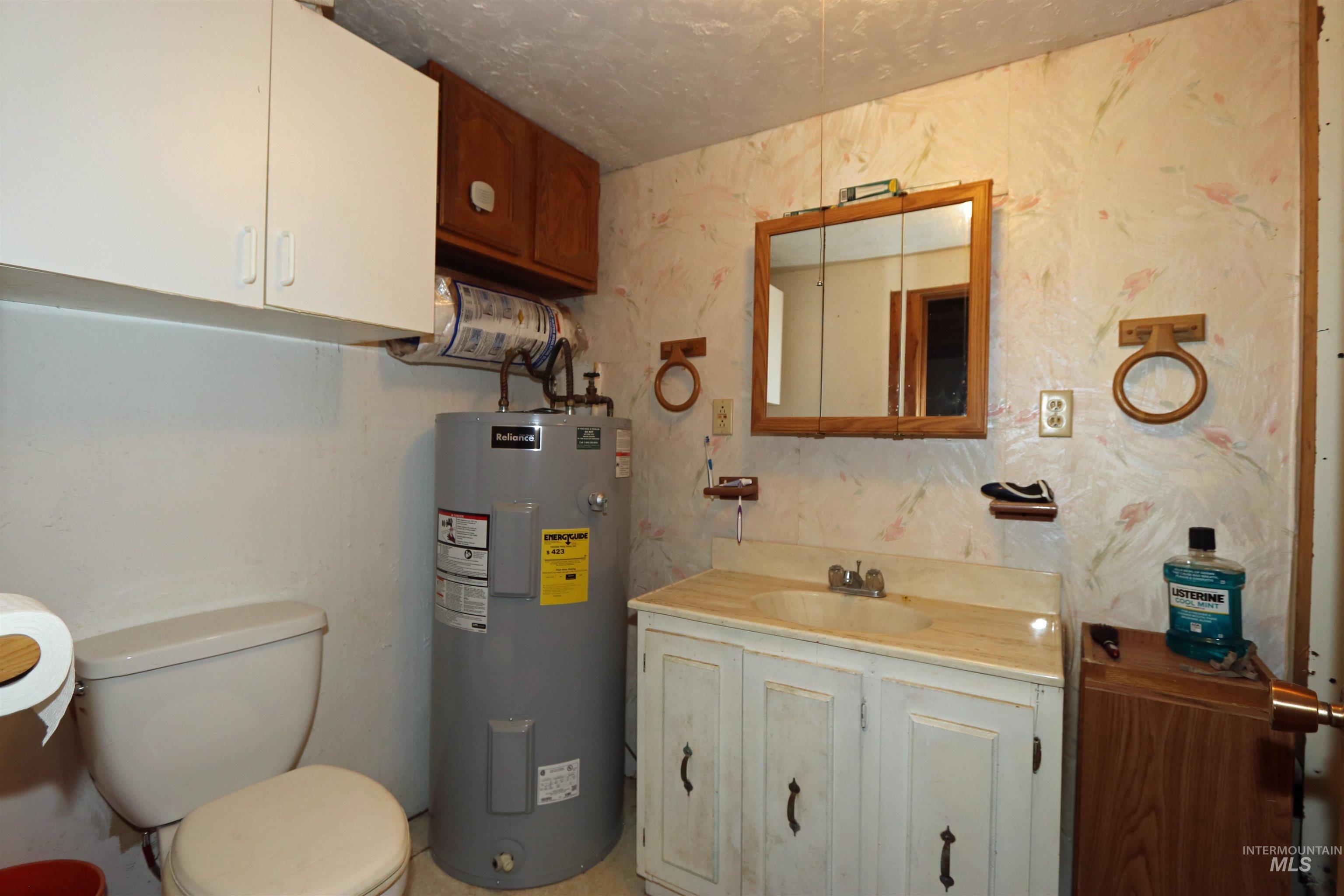 1201 Pfi Extension Elk City, ID 83525 - Photo 12 of 50 Half bath featuring water heater and vanity