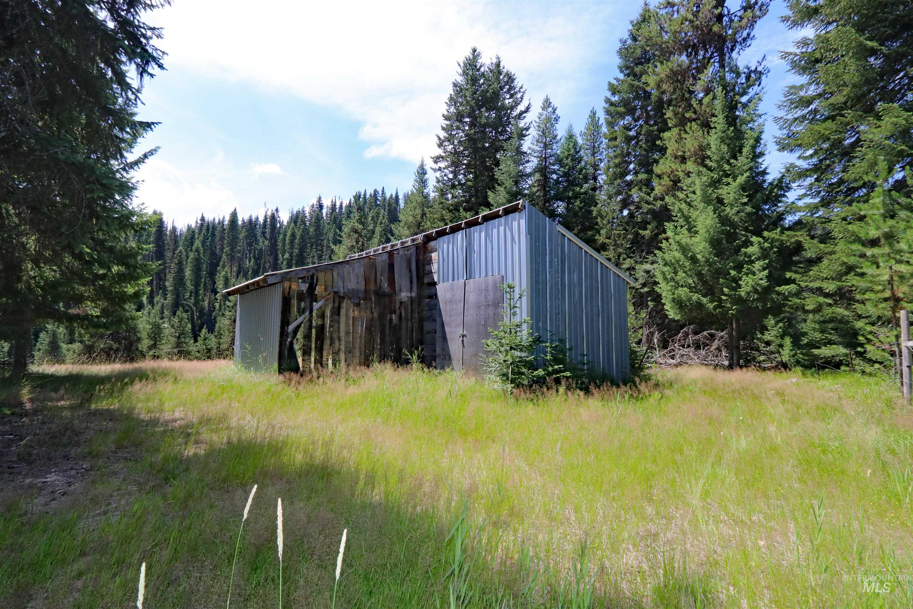 1201 Pfi Extension Elk City, ID 83525 - Photo 33 of 50 View of pole building featuring a forest view