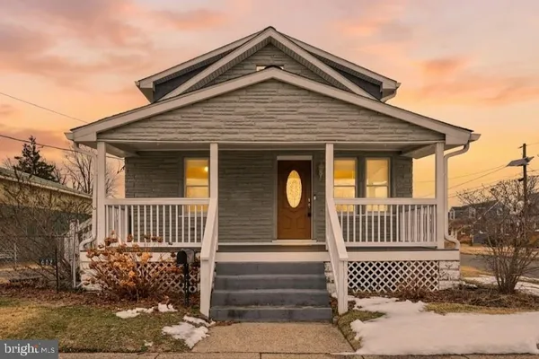 a front view of a house with a porch