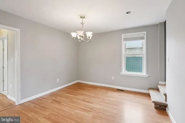 a kitchen with stainless steel appliances granite countertop a refrigerator sink and stove