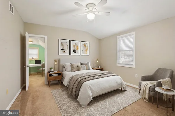 an empty room with a chandelier fan