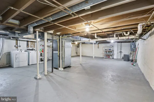 a view of empty room with wooden ceiling